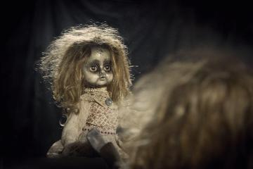 a creepy abandon old doll